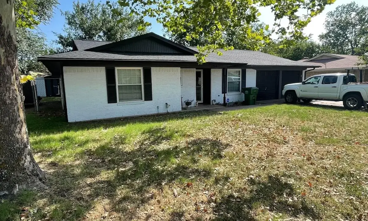 Professional roofing crew working on a residential roof in Falmouth